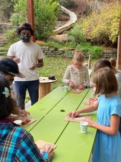 Jalen teaches students about ecosystems in the Bay Area.