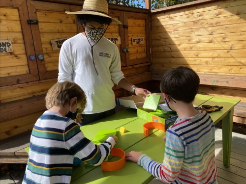 During recess, 2nd Graders approach the Field Station to explore the coding with a screenless rob...