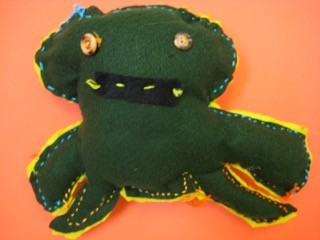 A stuffy doll sewn by a First Grade student.